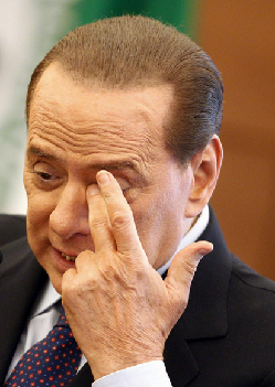 Mired in scandal, Berlusconi faces tax fraud trial