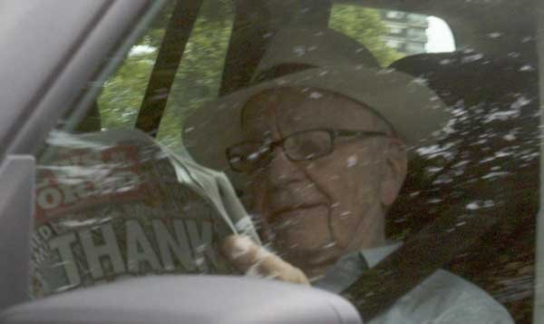 Rupert Murdoch arrives at UK tabloid offices