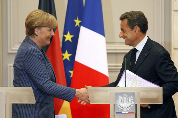 Sarkozy, Merkel push euro integration