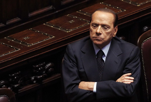Berlusconi rejects calls for him to quit