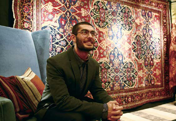 Iranian tries to sell the magic of his carpets