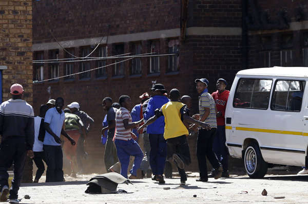 China meets challenge of South Africa riots