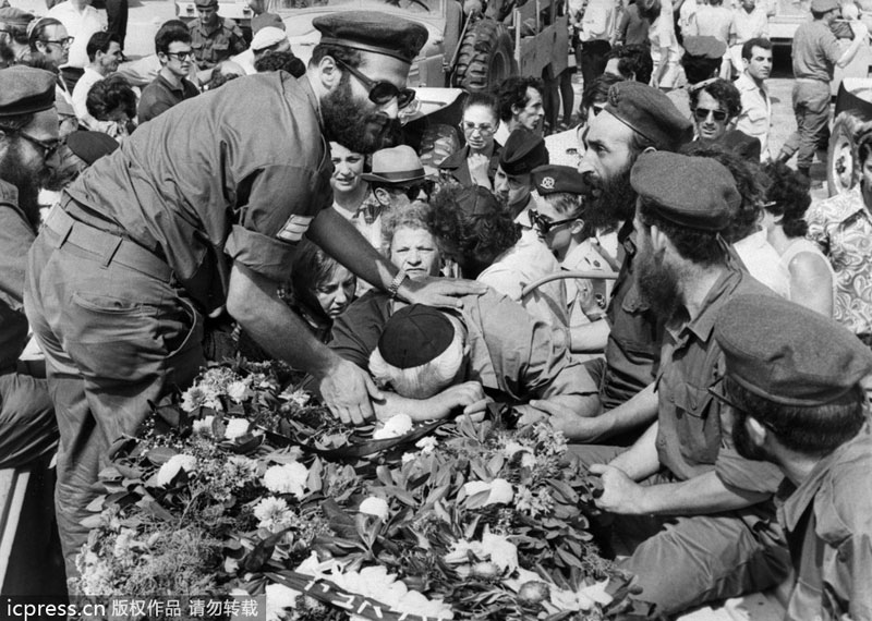 Family members cry during the funerals of Israeli Olympic team victims taken hostage by the Palestinian terrorists, in Tel Aviv, Israel, in September 1972. Attacks and threats affected sporting events in history