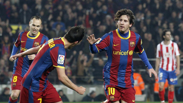 Messi treble helps Barca set new wins record
