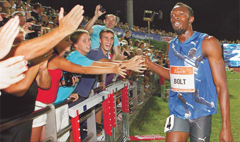 Bolt restakes claim with smashing run in 100m
