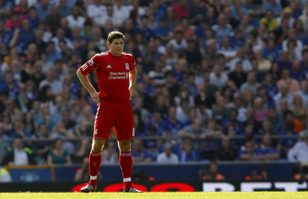Liverpool's Steven Gerrard watches play during their English Premier League soccer match against Everton at Goodison Park in Liverpool, northern England Oct 1, 2011. Gerrard awaiting results on latest injury scare