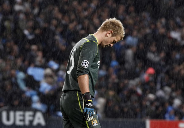 Manchester City's Joe Hart stands in the rain during their Champions League Group A soccer match against Villarreal at the Etihad Stadium in Manchester, northern England Oct 18, 2011. Depleted England may give Spain tough time
