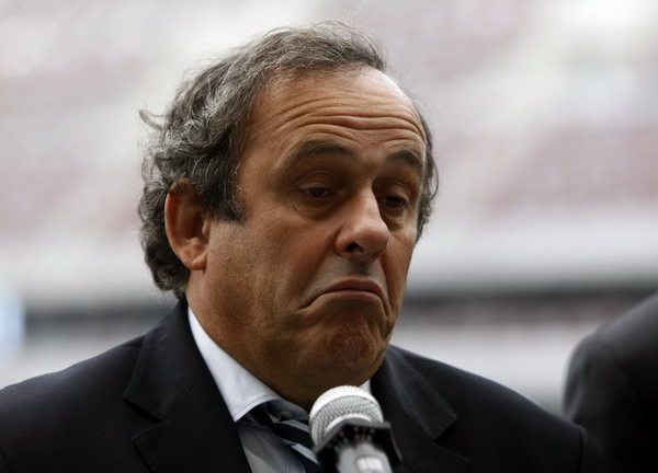 UEFA President Michel Platini speaks to the media during his visit to a construction site of the National Stadium, which will host the opening match of the Euro 2012 soccer championship in Warsaw in this Oct 12, 2011 file photo. Platini takes a dig at Blatter over extra linesmen