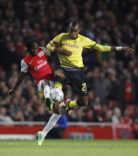 The irony of Arsenal becoming the first English team to reach the Champions League round of 16 was not lost on manager Arsene Wenger after his team beat Borussia Dortmund 2-1 at the Emirates Stadium on Wednesday to seal top spot in Group F. Wenger delights as Gunners advance in Europe