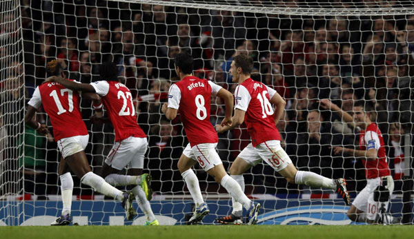 The irony of Arsenal becoming the first English team to reach the Champions League round of 16 was not lost on manager Arsene Wenger after his team beat Borussia Dortmund 2-1 at the Emirates Stadium on Wednesday to seal top spot in Group F. Wenger delights as Gunners advance in Europe