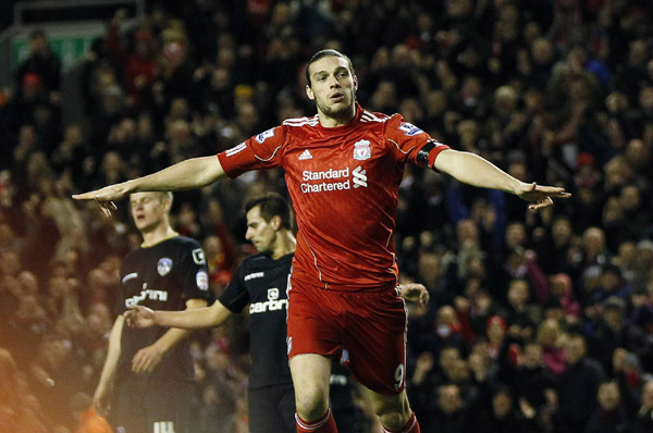Carroll scores as Liverpool crush Oldham