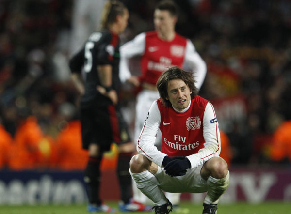 AC Milan survived an almighty scare against a rejuvenated Arsenal to scrape into the Champions League quarter-finals 4-3 on aggregate on Tuesday despite being thrashed 3-0 by the London side. AC Milan survives Arsenal onslaught to advance