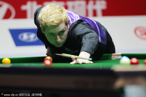 Ding rallies to beat Woollaston in China Open