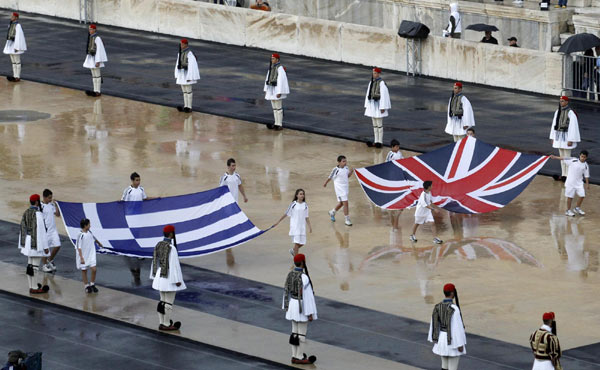 London receives flame in rainy Athens