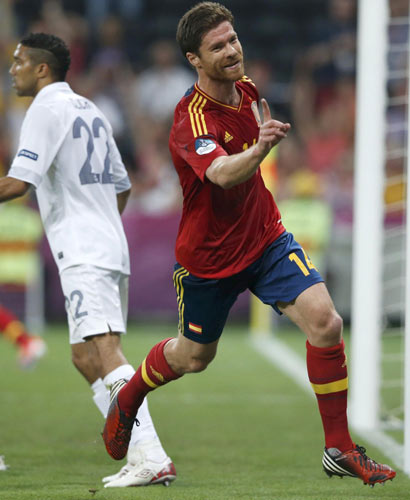 Spain coach hails match-winner Alonso's 'team