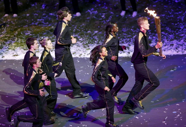 Seven teenagers light Olympic cauldron