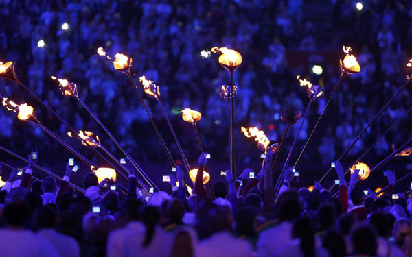 Seven teenagers light Olympic cauldron