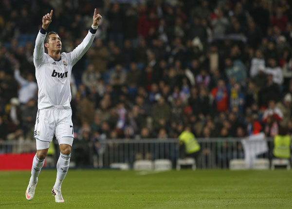 Ronaldo hat-trick fires Real into quarters