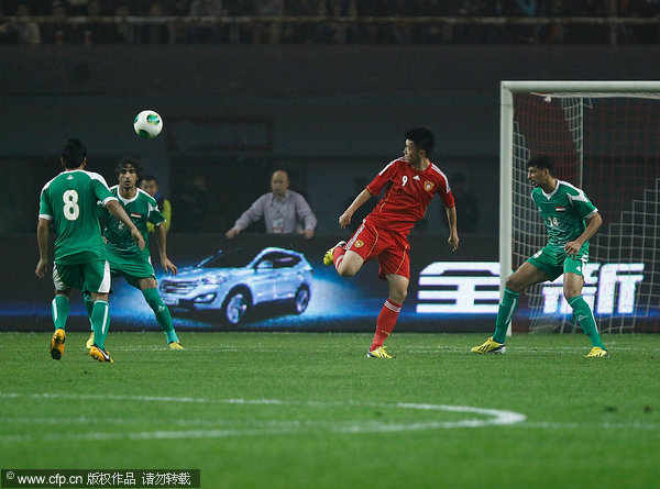 China leads Iraq 1-0 in 2015 Asian Cup qualifier