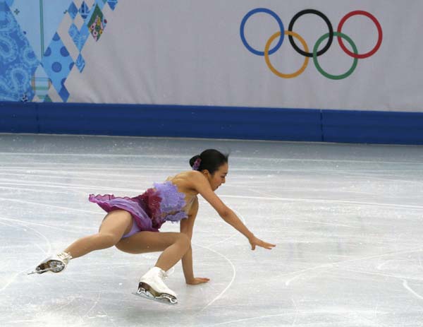 Mao Asada of Japan falls as she competes during the figure skating team ladies short program at the Sochi 2014 Winter Olympics, Feb 8, 2014. Japanese favorite Asada to make another try on 3A