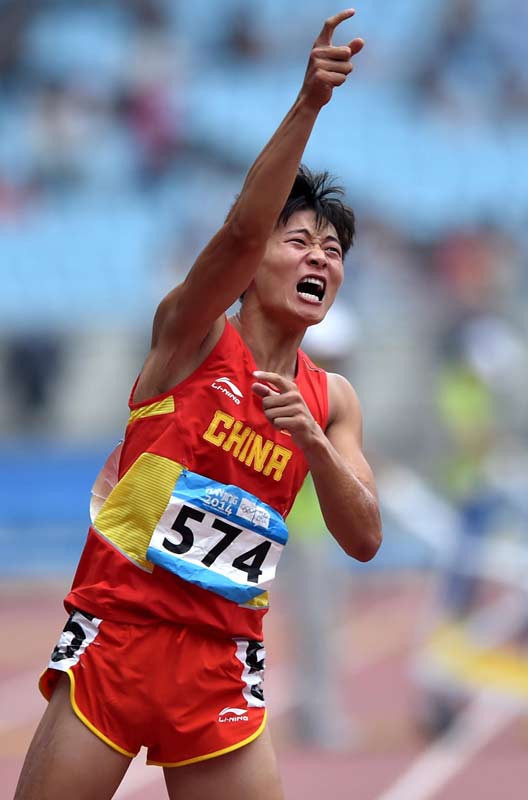 Xu wins 400m hurdles crown in cliff-hanger finish