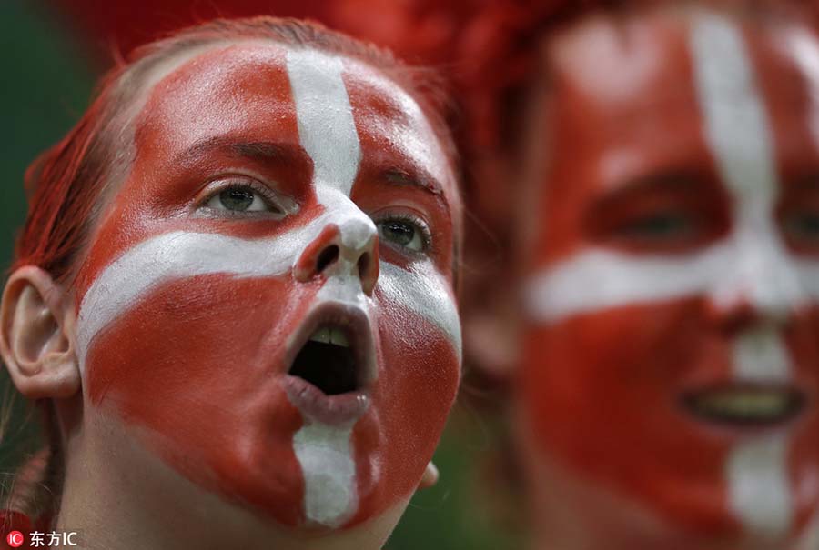Fans with face paint celebrate Olympics