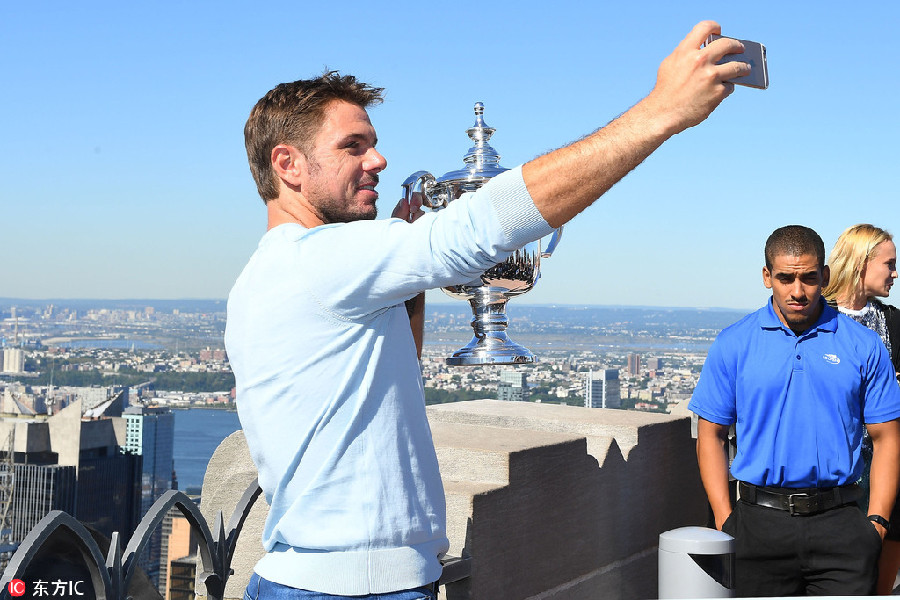 Wawrinka climbs 'top of the rock' for celebration