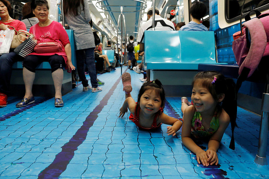 Commuters go for a swim on sports-themed trains in Taipei