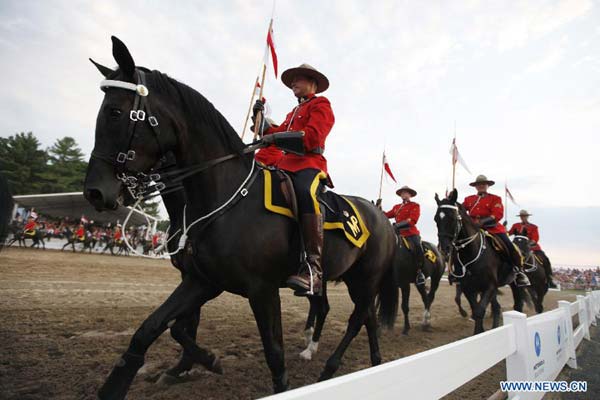 RCMP feast tourists with performances at Sunset Ceremonies in Canada