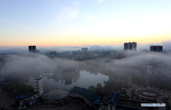 Cloud-blanketed Luoping county in SW China's Yunnan