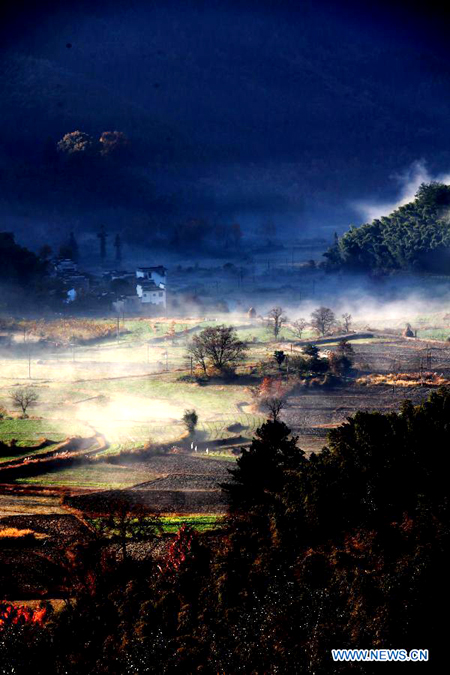 Fog-covered countryside residences in Huangshan