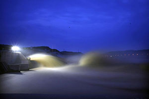 Visitors view sand-washing operation