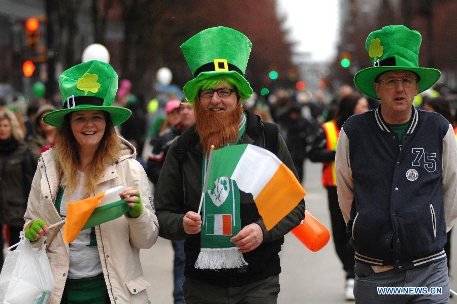 People take part in St. Patrick's Day Parade in Vancouver