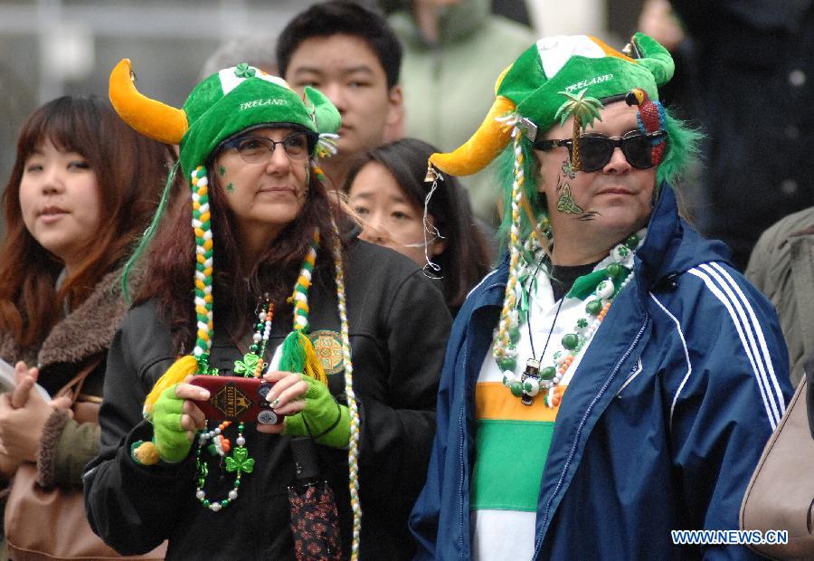 People take part in St. Patrick's Day Parade in Vancouver