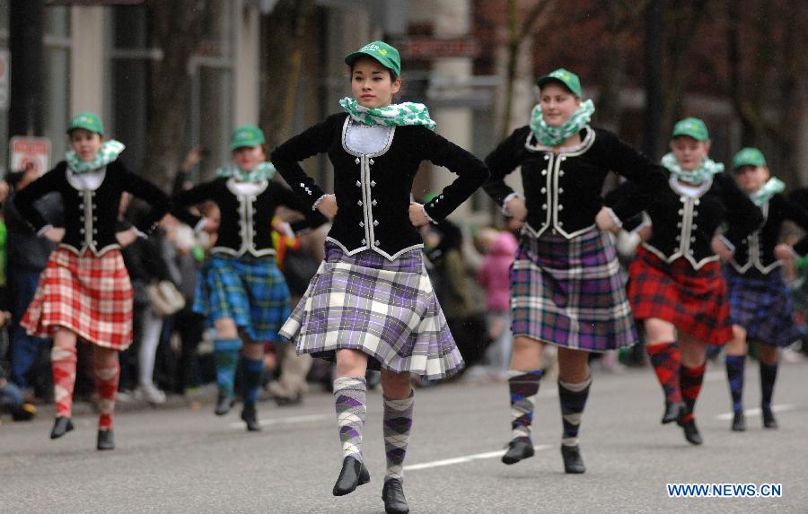 People take part in St. Patrick's Day Parade in Vancouver