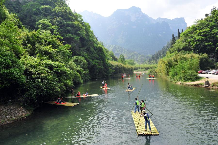 Tourists enjoy bamboo rafting in China's Hubei