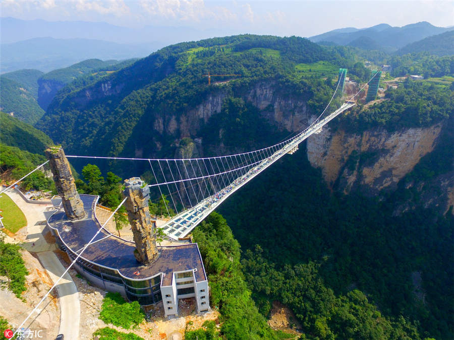 World's longest, highest glass bridge opens in Hunan