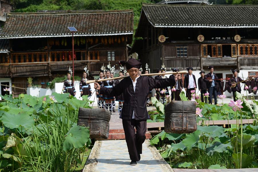 People of Dong ethnic group perform to promote local tourism