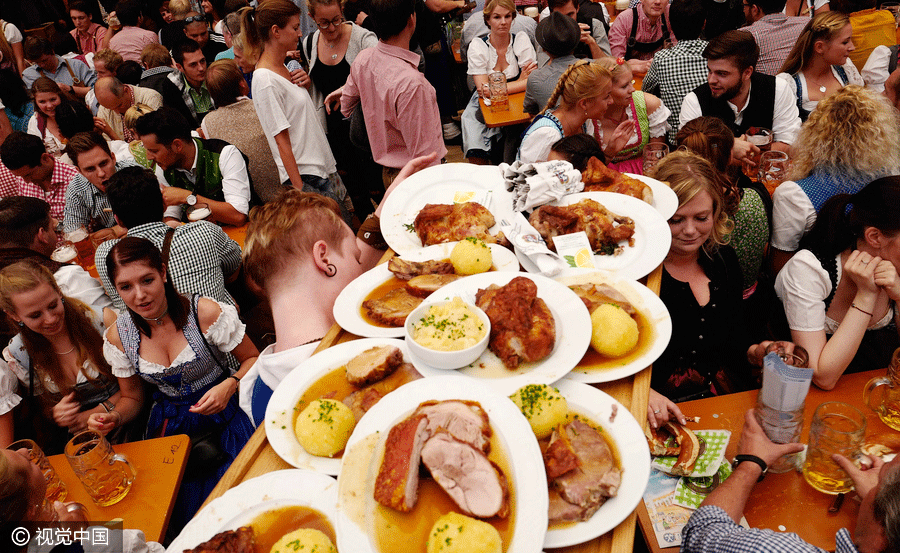 Dancing and drinking during 2016 Munich Oktoberfest
