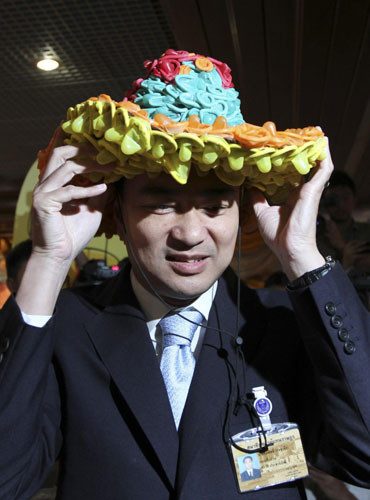 Hat made with condoms falls on PM's head