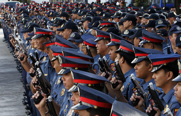 Manila police tape their guns for safety