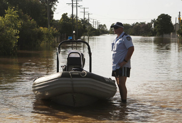 Australian city cut off by floods braces for more