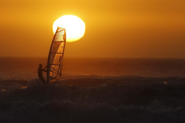 Windsurfers taking on waves in Cape Town