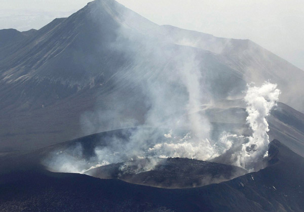 Japan volcano erupts with big blast of ash, rocks