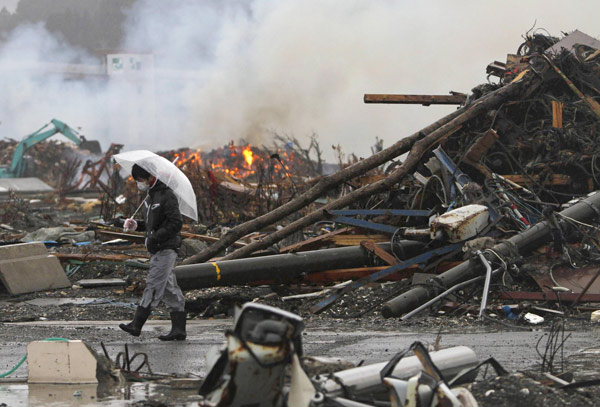 Japan plans massive search for quake bodies