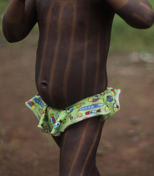Body painting for Kayapo people in N Brazil