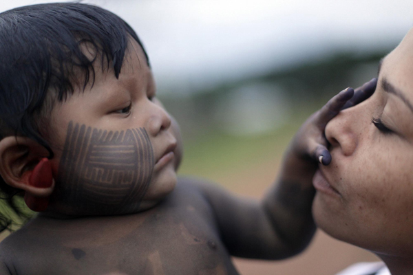 Body painting for Kayapo people in N Brazil
