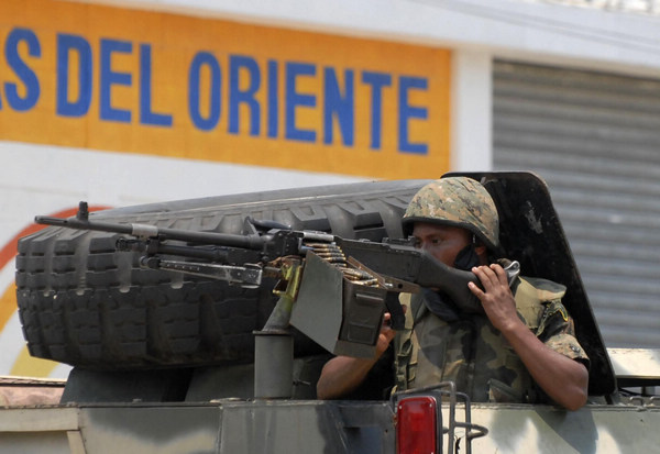 Guatemalan police search for massacre suspects