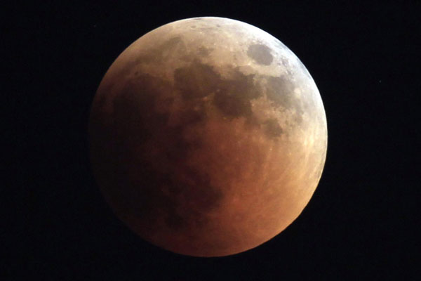 Volcano ash turns Asian eclipse blood red