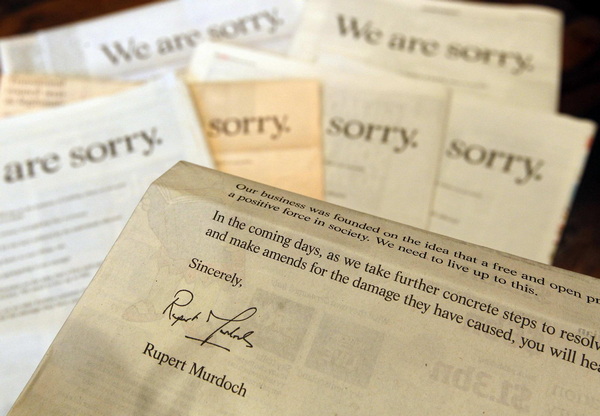 Murdoch says, 'We're sorry' for hacking scandal